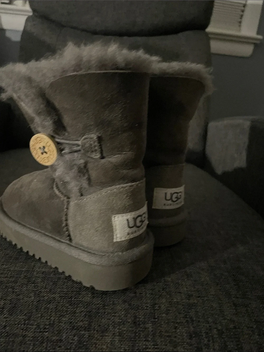 UGG Kids Short Shearling Boots in Gray with Pom Detail